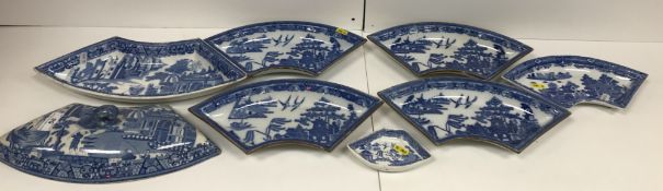 A set of four early 19th Century Spode blue and white transfer decorated willow pattern crescent