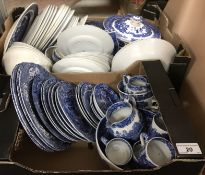 A box containing assorted 20th Century willow pattern dinner wares to include plates, bowls,