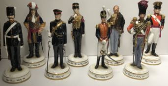A collection of eight Michael Sutty porcelain figures of 