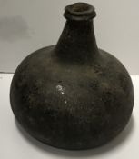 A 17th Century black glass wine bottle of onion form, 13.