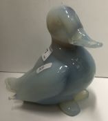 A Continental Murano type vaseline glass overlaid figure of a seated duck 15 cm high