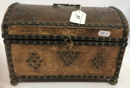 A 19th Century brass studded leather dome top trunk of small proportions with brass swing handle,