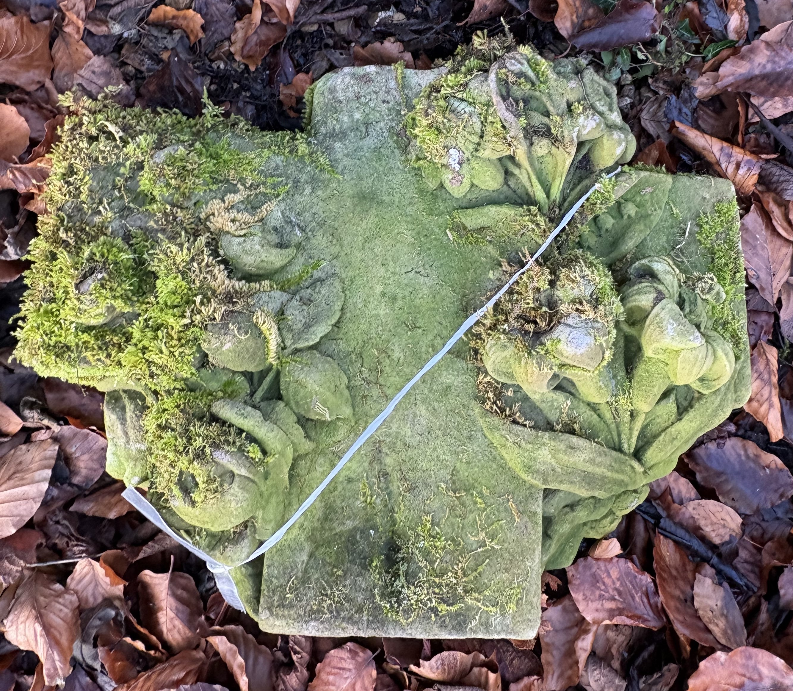 A carved natural stone section with floral decoration, appears to be the top of a cross, - Image 2 of 4