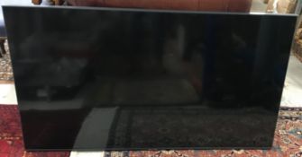 A Samsung UE55AU7100K wall mounted 55