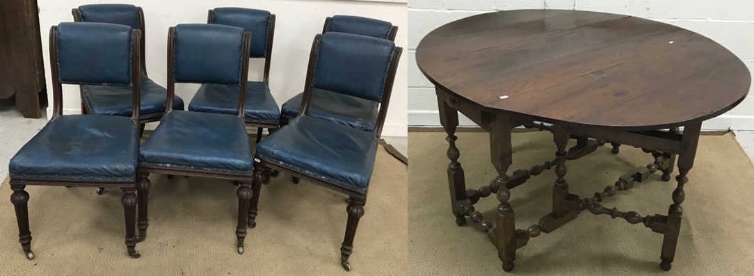 A set of six Victorian walnut framed blue wrexine upholstered scroll back dining chairs,