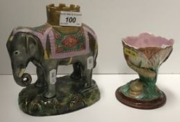 A 19th Century Staffordshire elephant and castle spill vase, 16.