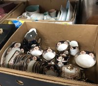 A box of assorted Poole twin-tone china to include jugs, hot water jug, tea wares, etc.