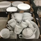 Two boxes containing a Legendary by Noritake Regency silver part dinner service to include dinner