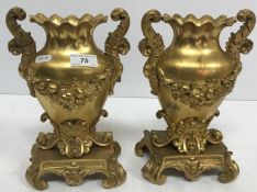 A pair of 19th Century Continental gilt bronze vases of oval form with flared rims,