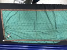 A box containing a green silk work table