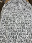 A pair of cotton blue and cream stylised