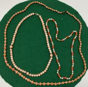 A pale pink coral bead necklace, the thr