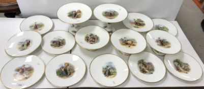 An early 20th Century white glazed and gilt decorated dessert service comprising two tall tazzas,