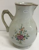 A 19th Century Chinese armorial baluster shaped jug with floral spray decoration,