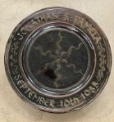 A Ray Finch for Winchcombe Pottery charger with slip decoration to the centre field and inscribed