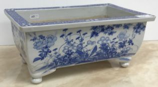 A late 19th Century Japanese blue and white glazed jardiniere of rectangular form,