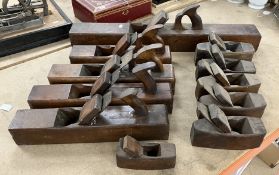 A box of antique smoothing planes, to include one stamped 