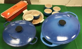 Two boxes of assorted Le Creuset and other wares including ramekins,