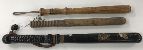 A large black painted and gilt decorated