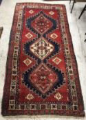 A Caucasian rug, the central panel set w