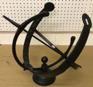 A modern black painted iron Armillary sp