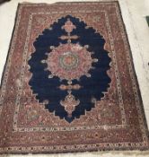 A Persian carpet, the central panel set