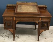 An Edwardian mahogany and satinwood inla