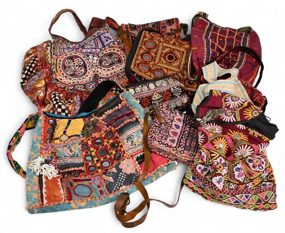 Collection of assorted Indian Tribal Fabric Bags, multi coloured, decorated with shells, mirrors and