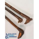 Selection of Walking Sticks all having carved animal heads to include Badger, Giraffe, Rhinoceros (