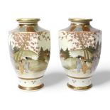 A pair of Japanese Satsuma pottery vases, late Meiji period, of hexagonal baluster form, gilded