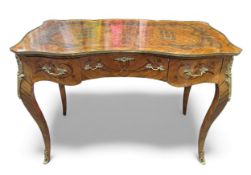 A Louis XV style kingwood and rosewood writing desk, with ornate parquetry top and serpentine front,