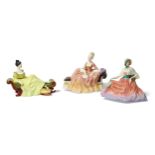 Three Royal Doulton figures, comprising ‘Memories’, HN2030, ‘Reverie’, HN2306, ‘At Ease’, HN2473,