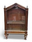 A late 19th/ early 20th century Gothic revival mahogany small floor standing display cabinet, with