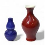 A Chinese porcelain 'Sang de boeuf' glazed small baluster vase, with Qianlong six character seal