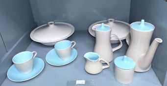 An assortment of Poole Pottery tea wares in the twin-tone 'Dove Grey' and 'Sky Blue' colour