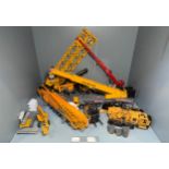 A collection of precision built die-cast scale model construction vehicles and equipment, comprising