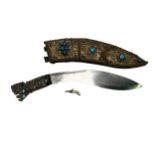 A Kukri knife with horn handle and sheath decorated with filigree work set with turquoise and