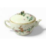 A late Chinese Qing Dynasty famille rose porcelain small teapot and cover, painted on-glaze in