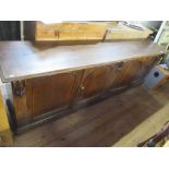 A long 19th century sideboard, fitted four cupboard doors, width 100ins