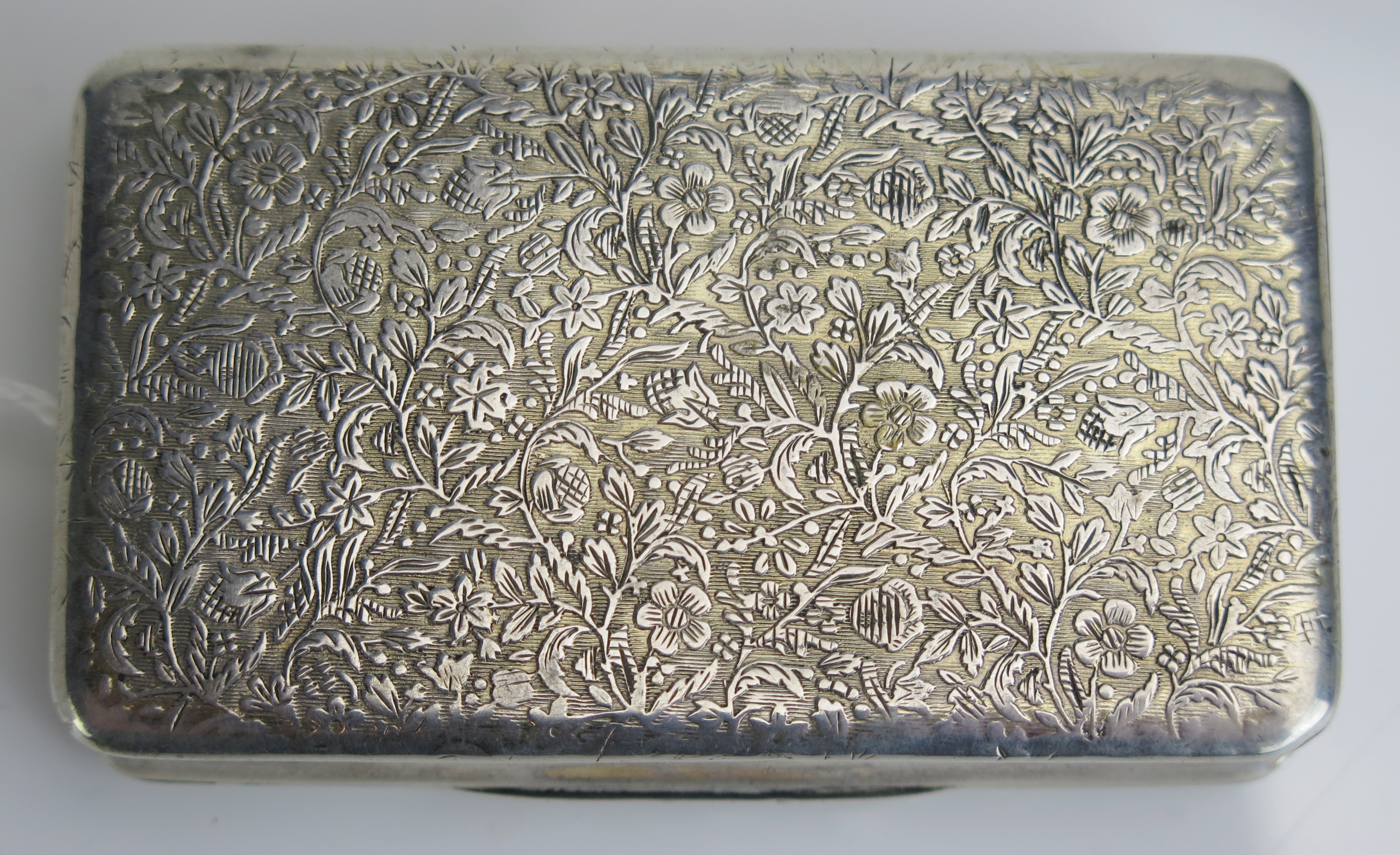 An early 19th century French parcel gilt and silver snuff box, stamped marks, of rectangular form, - Image 4 of 4