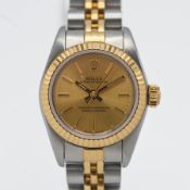 Rolex, a 1999 ladies Oyster Perpetual steel and gold wristwatch, diameter 25mm. With box and papers.