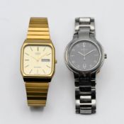 A gents Gucci stainless steel wristwatch with calendar and a 'vintage' Casio Quartz Day wristwatch