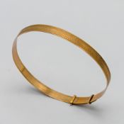 A 9ct gold bangle, inscribed 'Sally 15th October 1967', approx 4.3g.
