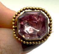 A rare Georgian gold foil back brooch, set with a light pink octagonal set stone approx 4.9g.
