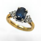 A diamond and sapphire dress ring, set in 9ct yellow gold, size G/H, approx 3.7g.