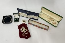 A mixed collection of costume jewellery including pearls.