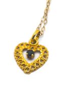 A 'Heart' shaped pendant set with a sapphire, set in 18ct yellow gold, on a 9ct gold chain.