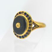 A 14k onyx style ring, size F/G, approx 2.8g.