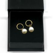 A pair of pearl drop earrings, set in 9ct gold.