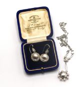 A diamond and pearl Art Deco style necklace (not hallmarked) set in white metal together with a pair